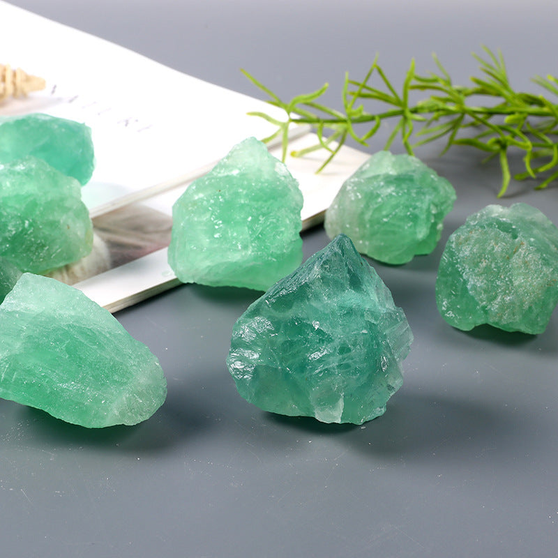 Raw green fluorite crystal specimen with natural color variations for crystal healing