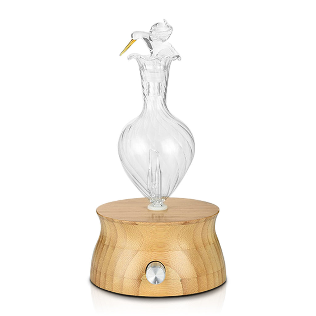 Natural wood essential oil diffuser with LED lights creating calming atmosphere