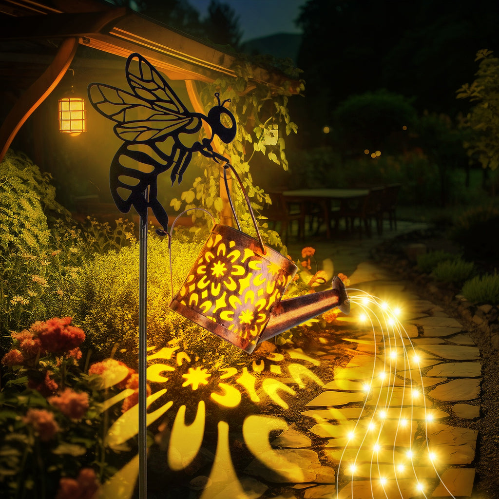 Garden scene with solar light shaped like a bee and flowers, surrounded by foliage.