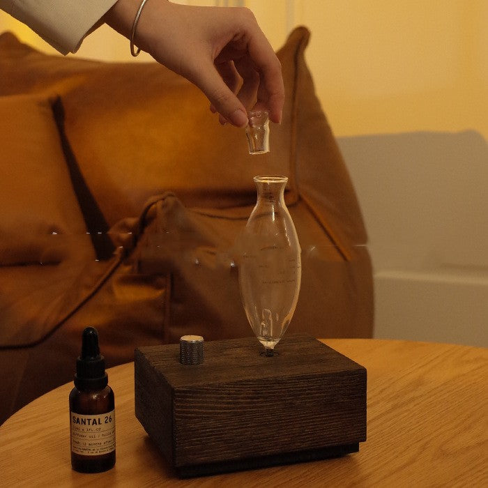 Wood grain aroma diffuser lifestyle shot in home setting