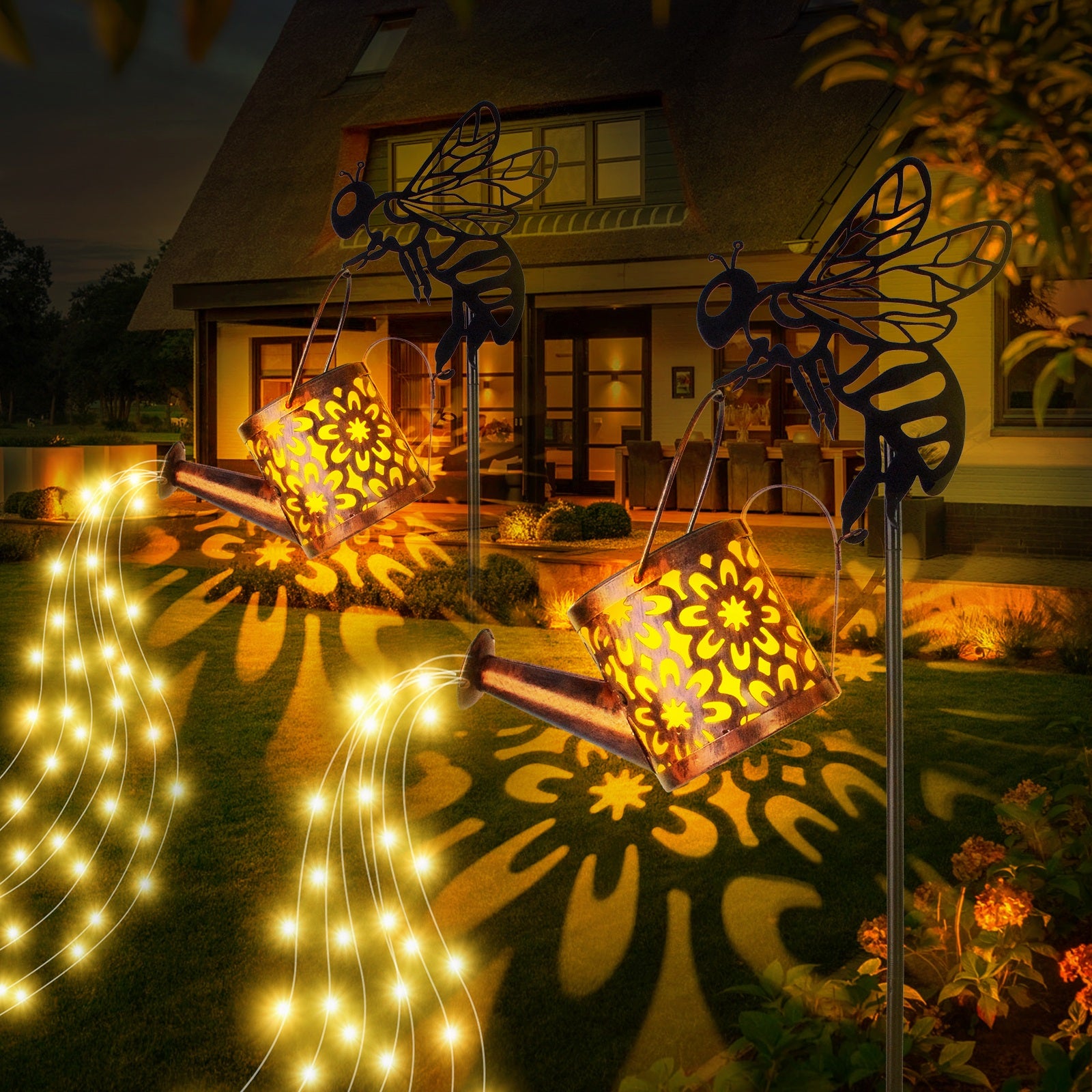 Decorative outdoor lights with butterfly designs casting patterns on a house exterior.