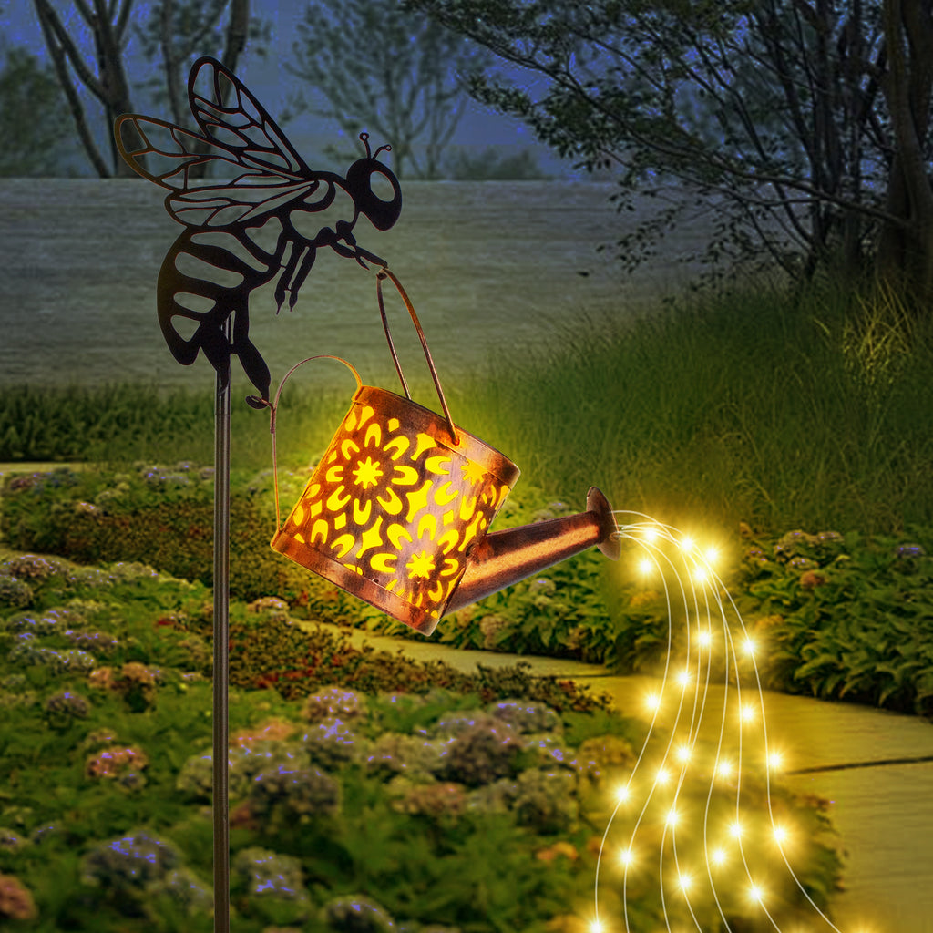 Garden stake with solar light and fairy lights in a garden setting