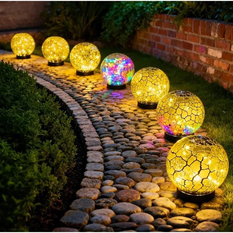 Shatterproof crackle glass ball solar lights illuminating garden pathway at night